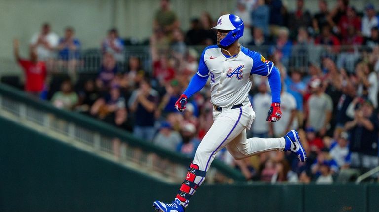 Atlanta Braves' Jorge Soler runs to second base after hitting...