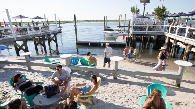 Head to Buoy Bar in Point Lookout for cocktails and...