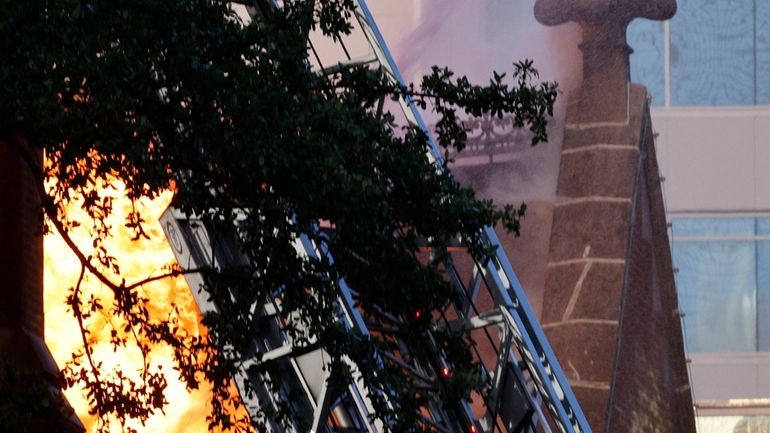 Firefighters battle a fire at First Baptist Dallas church on...