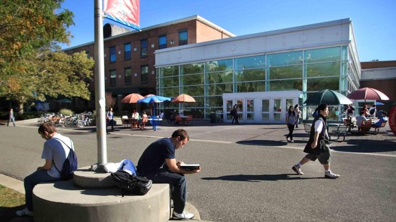 Students study near the Student Activity Center on campus at...