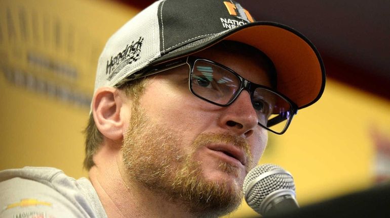 Dale Earnhardt Jr. speaks to the media during the NASCAR...