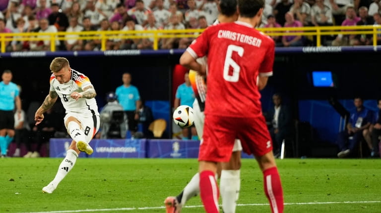 Germany's Toni Kroos shots a free kick during a round...