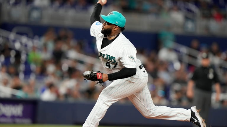 Miami Marlins starting pitcher Johnny Cueto throws during the first...