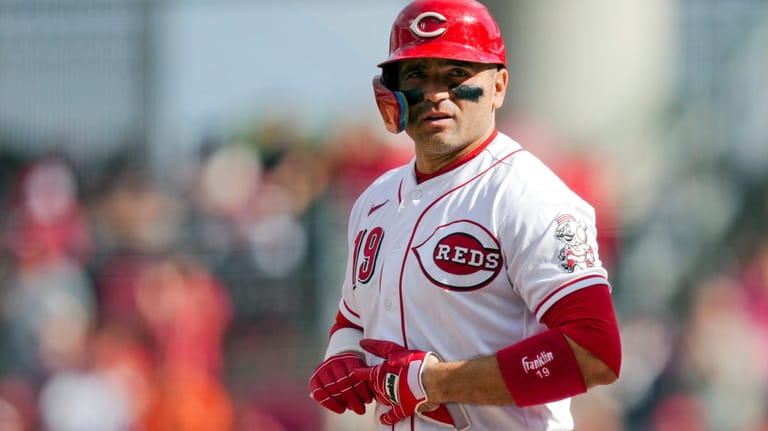 Cincinnati Reds' Joey Votto stands at first base after hitting...