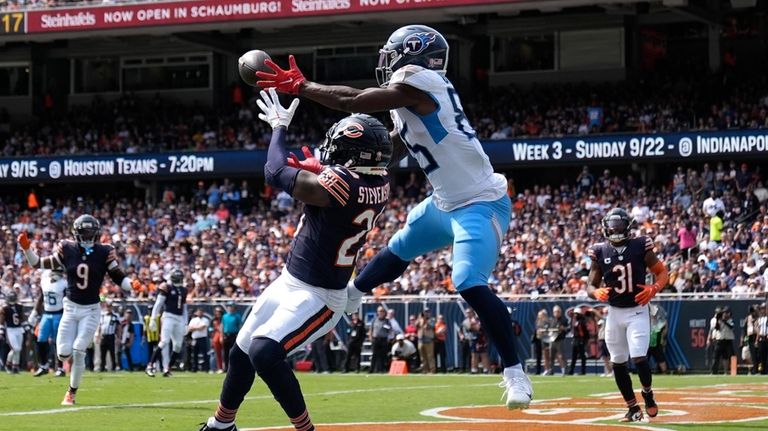 Tennessee Titans tight end Chigoziem Okonkwo catches a touchdown pass...