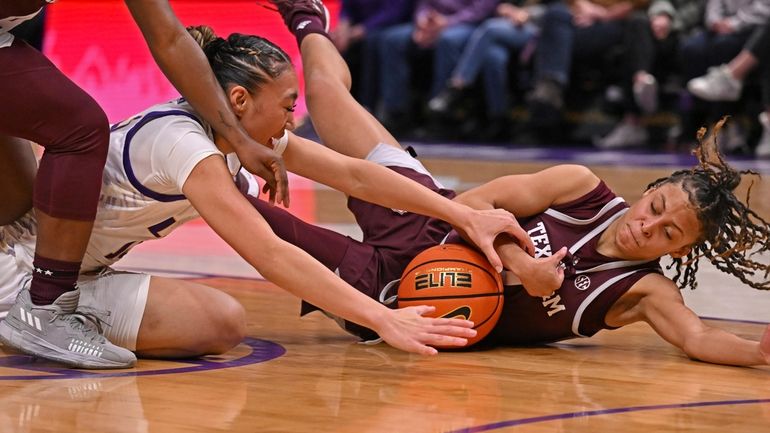 LSU guard Last-Tear Poa, left, and Texas A&M guard Mya...