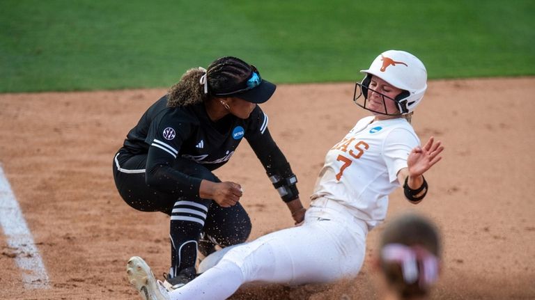 Texas A&M infielder Kennedy Powell, left, tags out Texas' Ashton...