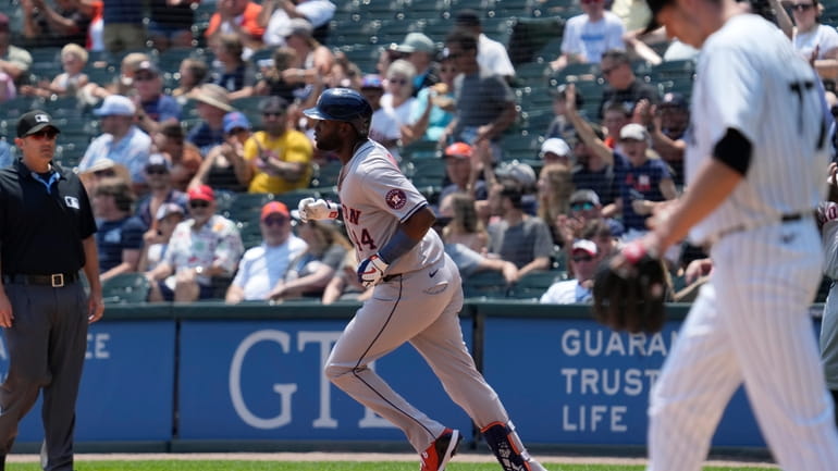 Houston Astros' Yordan Alvarez rounds the bases after hitting a...