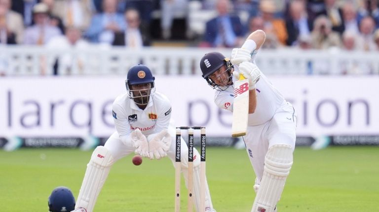 England's Joe Root bats during day one of the second...