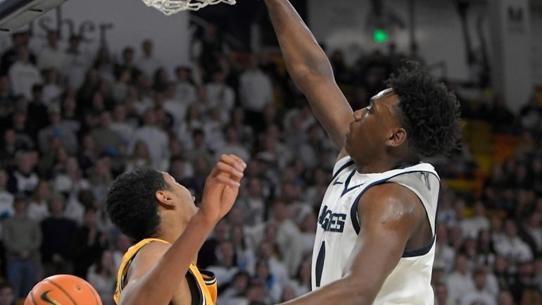 Utah State forward Great Osobor dunks as Wyoming forward Caden...