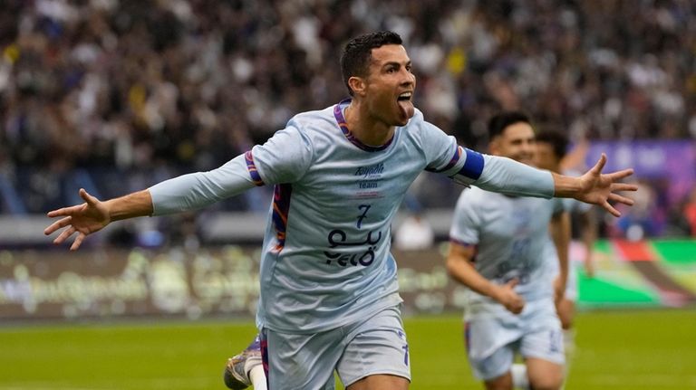 Cristiano Ronaldo celebrates after scoring his side's second goal playing...