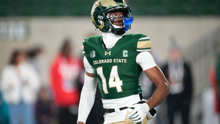 Colorado State wide receiver Tory Horton (14) warms up before...