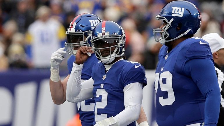 Tyrod Taylor of the Giants looks on against the Rams at...