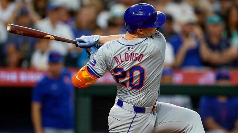 Pete Alonso of the Mets strikes out swinging in the seventh...