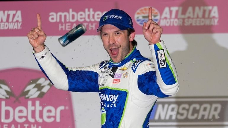 Daniel Suarez reacts after winning the NASCAR auto race at...