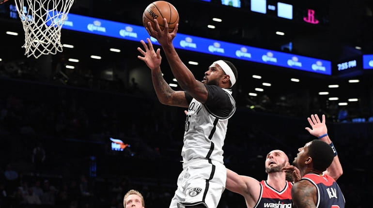 Brooklyn Nets forward Trevor Booker sinks a layup against the...