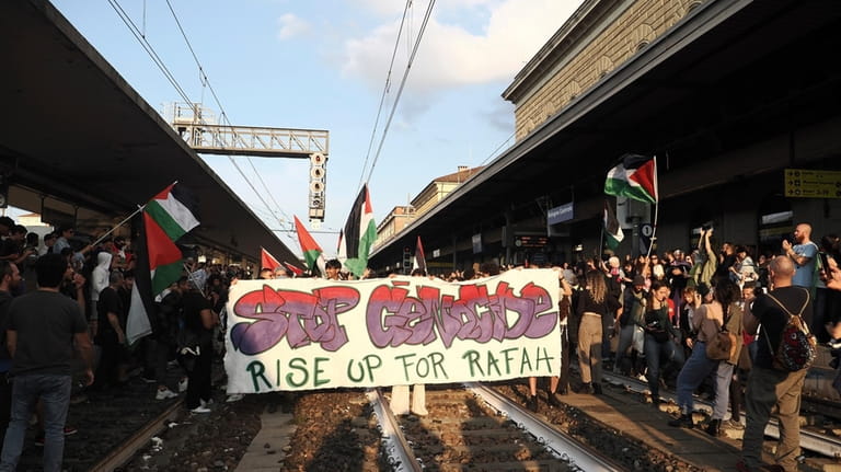 People stage a Pro-Palestinians protest at the Bologna Centrale train...