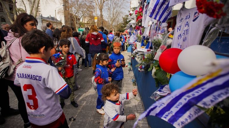 A memorial for late soccer player Juan Izquierdo stands outside...