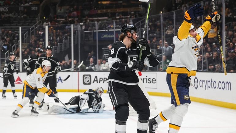 Nashville Predators center Yakov Trenin, right, celebrates after scoring against...