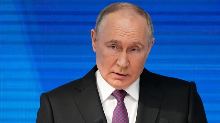 Russian President Vladimir Putin delivers his state-of-the-nation address in Moscow,...