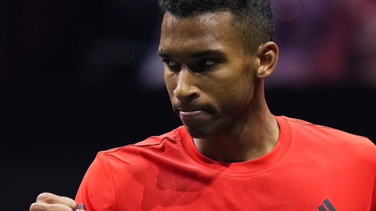 Team World's Felix Auger-Aliassime celebrates a point against Team Europe's...