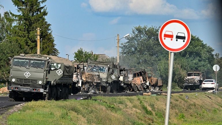 A view of the column of Russian Army trucks damaged...