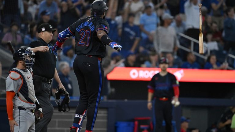 Toronto Blue Jays' Vladimir Guerrero Jr. (27) throws his bat...