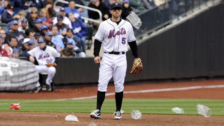 David Wright of the New York Mets stands among the...