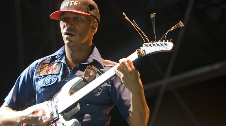 Guitarist Tom Morello for the band Rage Against The Machine,...