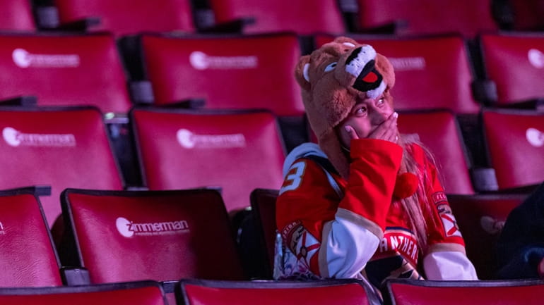 A Florida Panthers fan reacts during a watch party for...