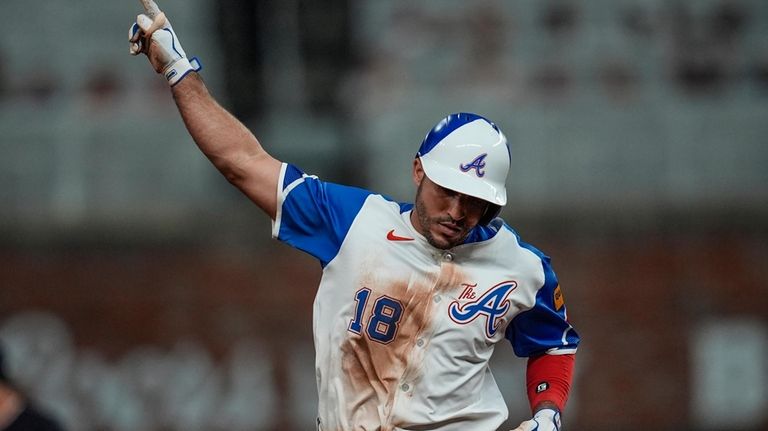 Atlanta Braves' Ramón Laureano (18) celebrates his solo homer against...