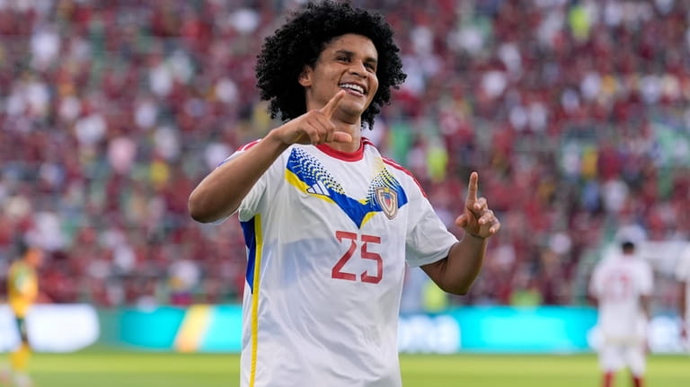 Venezuela's Eduard Bello celebrates after scoring a second half goal...