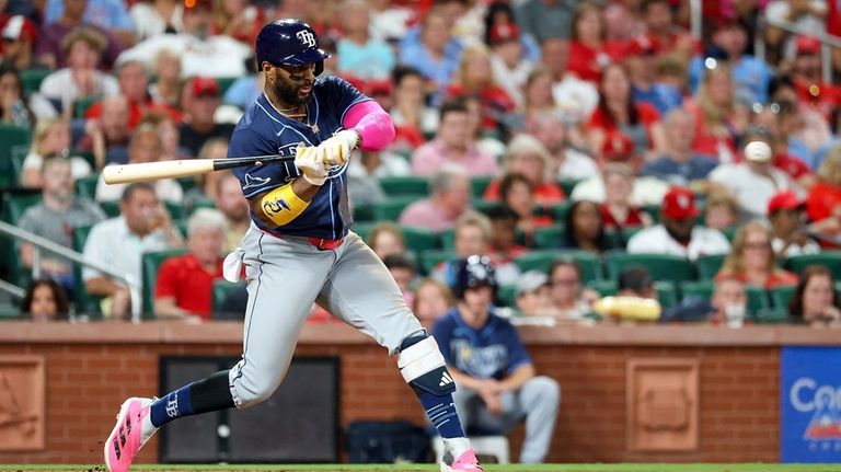 Tampa Bay Rays' Yandy Diaz hits a sacrifice fly during...