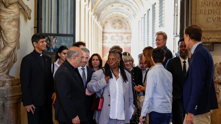 Whoopi Goldberg, centre, arrives for an audience with Pope Francis...