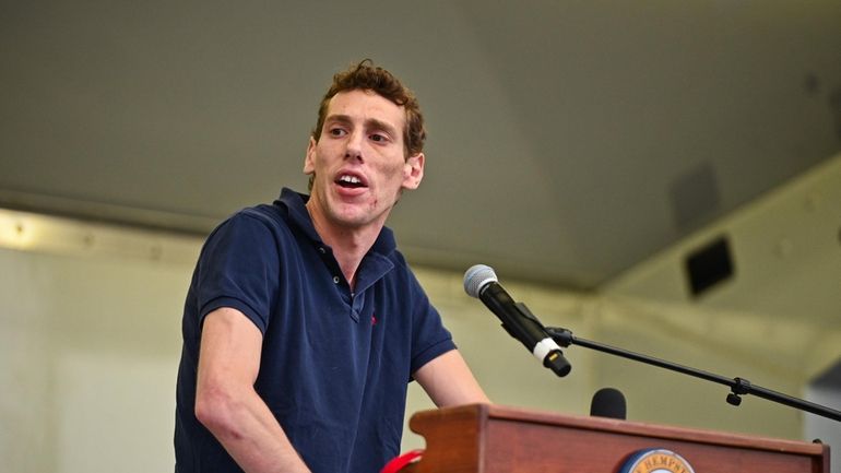 Joseph Borgen addresses the crowd at a Cedarhurst rally against...