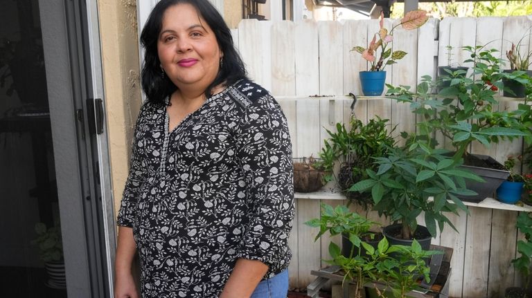 Lorena García, from Venezuela, poses for a portrait in the...