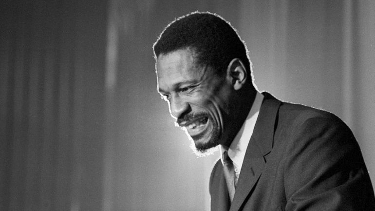 Bill Russell grins at announcement that he had been named...