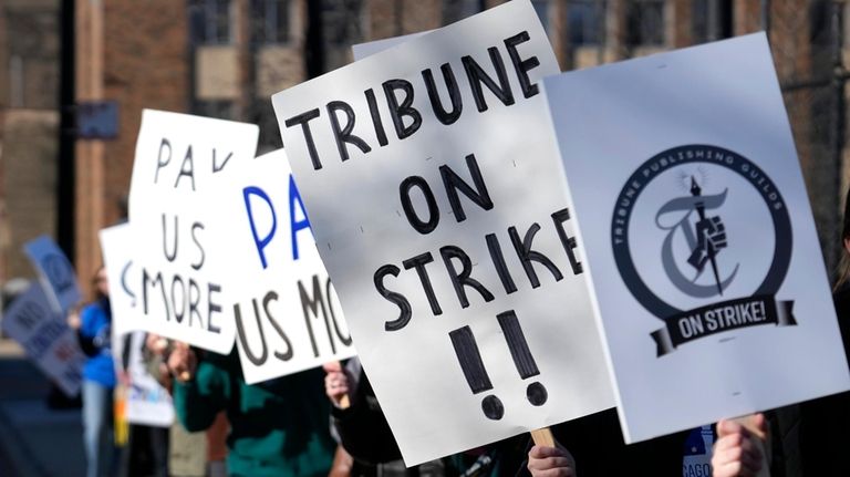 Chicago Tribune newsroom employees picket outside the newspapers Freedom Center...