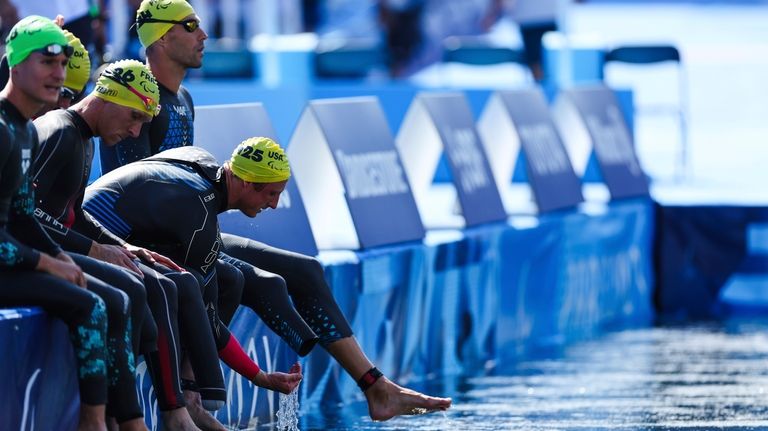 The United State's Carson Clough, far right, prepares to compete...