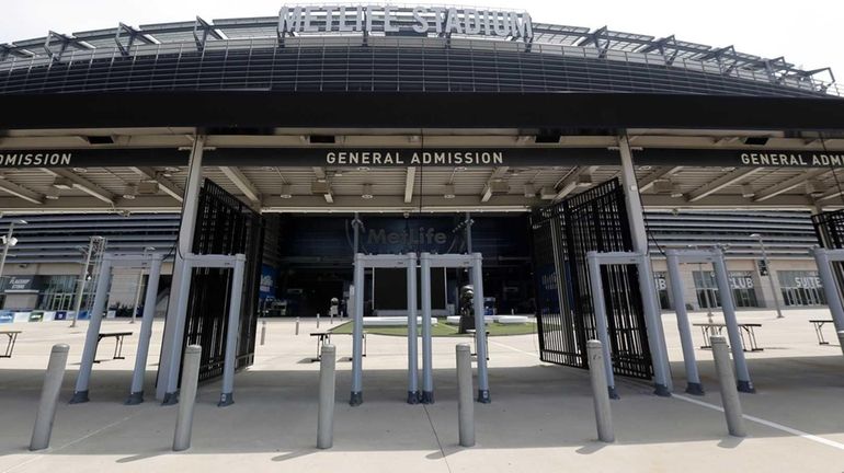 In this May 28, 2015, photo, metal detectors stand outside...