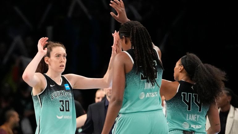 New York Liberty forward Breanna Stewart (30) and forward Jonquel...