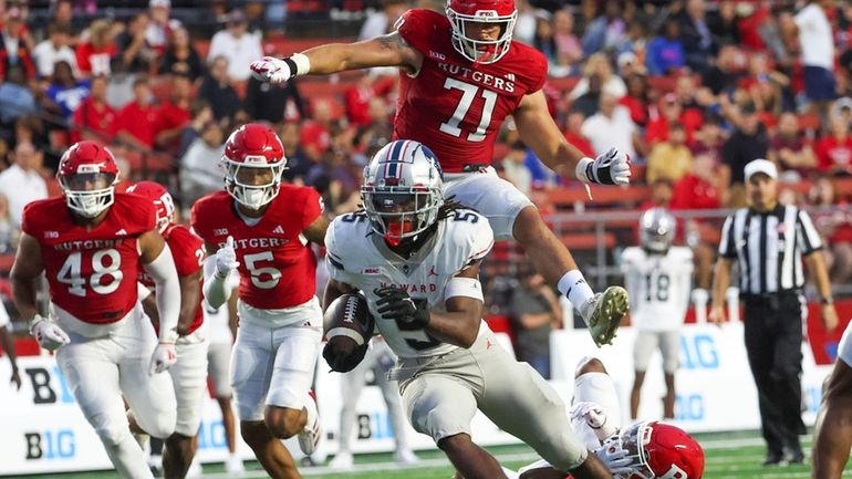 Howard running back Eden James (5) carries the ball as...