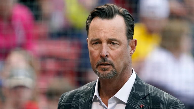 Former Boston Red Sox player Tim Wakefield looks on before...