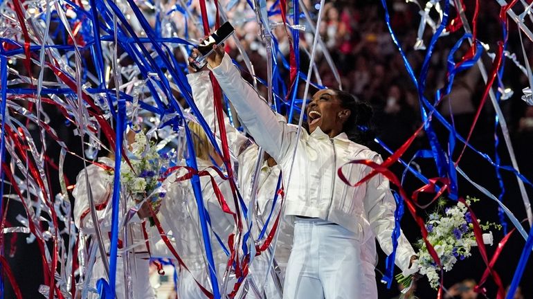 Simone Biles and the U.S. women celebrate as the 2024...