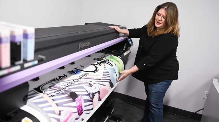 Owner Karrie Anne Vitti with the Mimaki printer at Let's...
