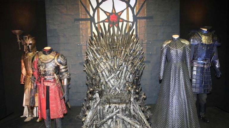 The Iron Throne and costumes on display during the launch...