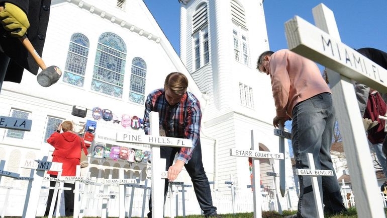 Parishioners at Sayville Congregational United Church of Christ install hundreds...