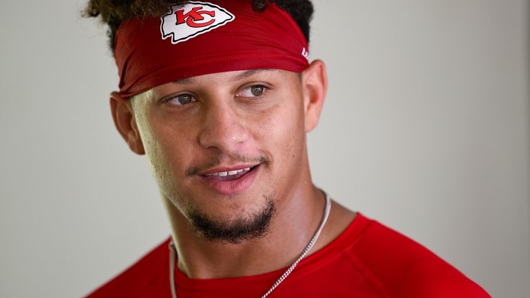 Kansas City Chiefs quarterback Patrick Mahomes answers questions from the...