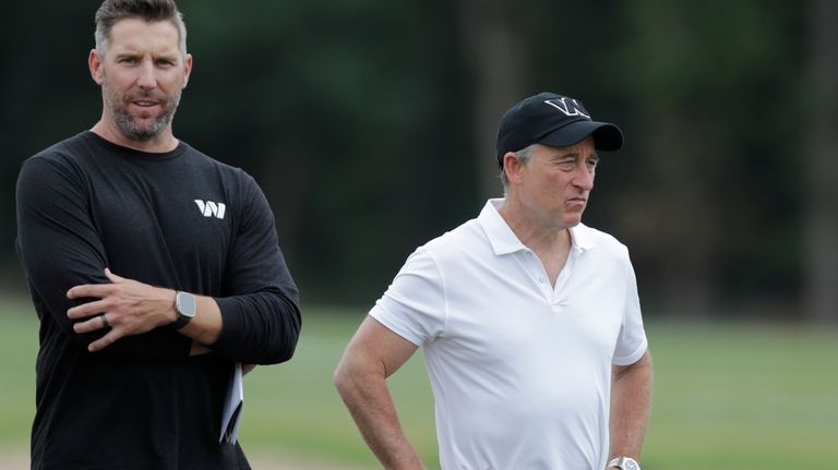 Washington Commanders general manager Adam Peters, left, and owner Josh...