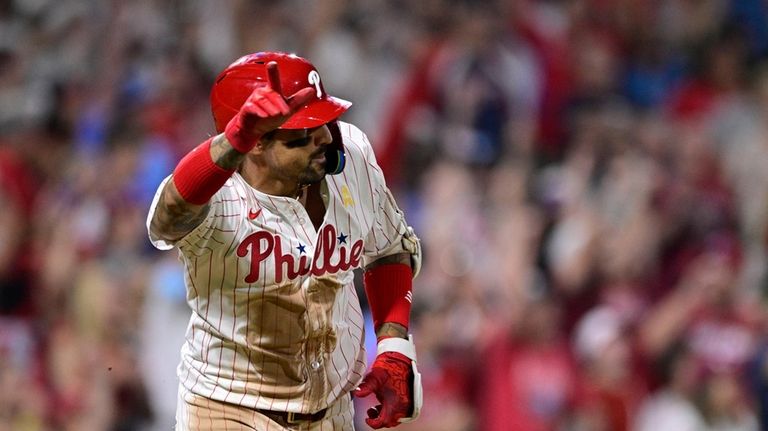 Philadelphia Phillies' Nick Castellanos reacts after hitting a walk off...